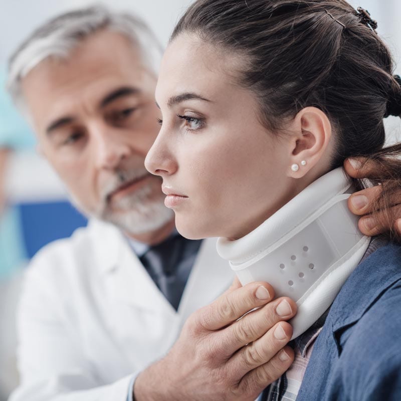 McLain Insurance Agency | Chesterfield, SC | workers comp insurance, young woman with neck injury getting checked by doctor